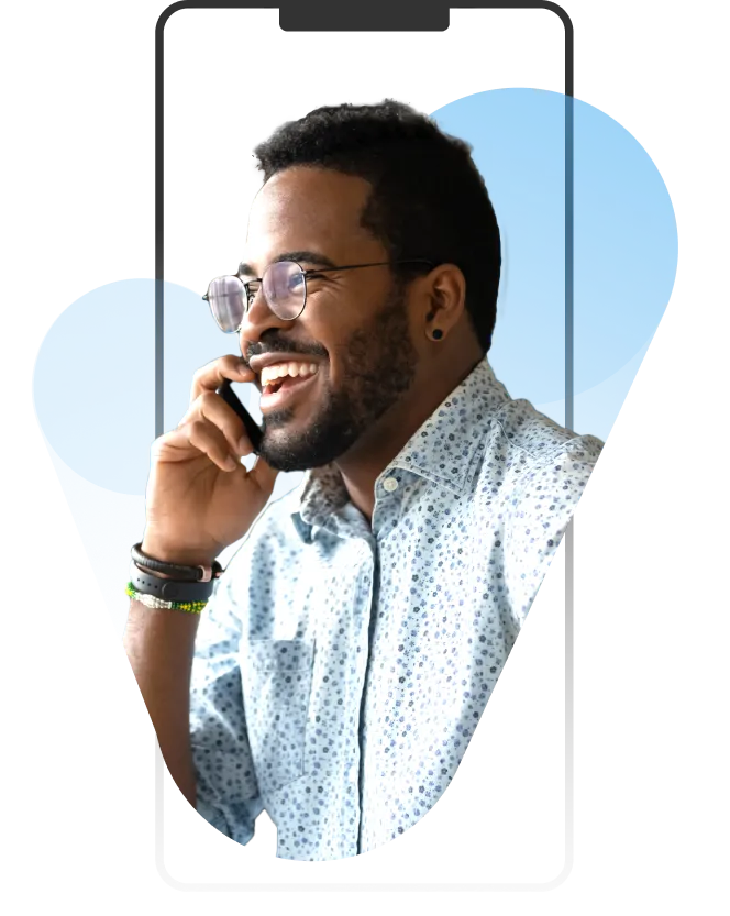 A man with glasses talking on a cell phone.