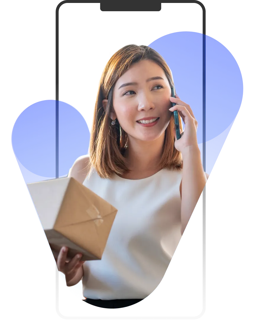 A woman holding a cell phone to her ear.