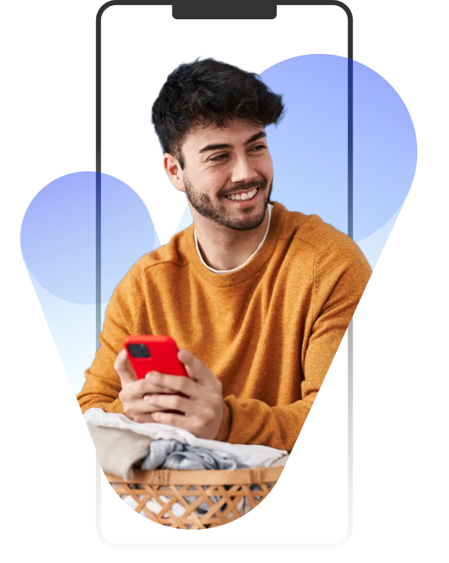 A man holding a red cell phone in his hand.