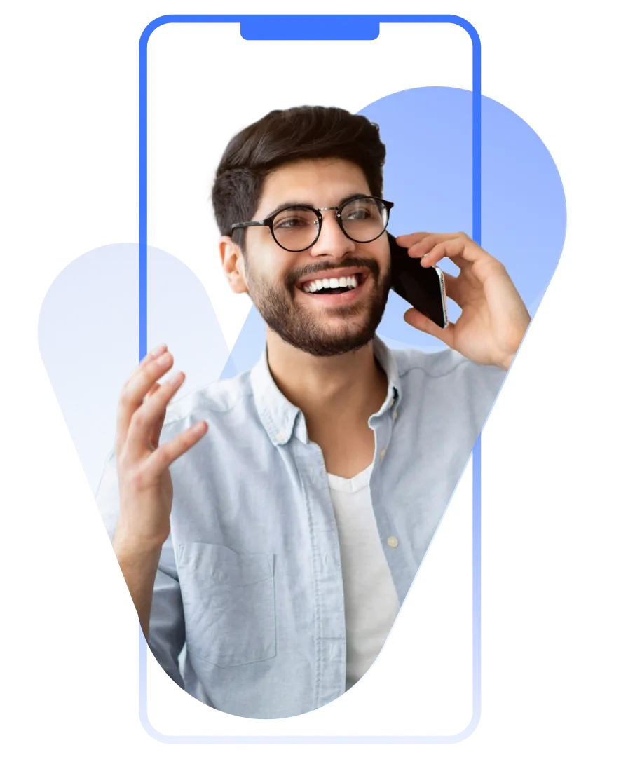 A man with glasses talking on a cell phone.