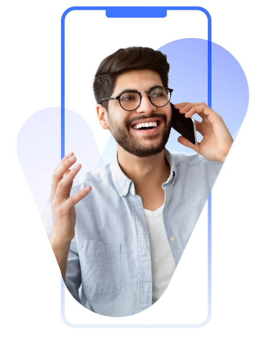 A man with glasses talking on a cell phone.